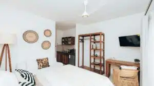 Cozy modern studio apartment interior with a blend of rustic and contemporary decor in Zanzibar, Tanzania.