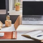 A stylish and contemporary home office setup with laptop and desk accessories.