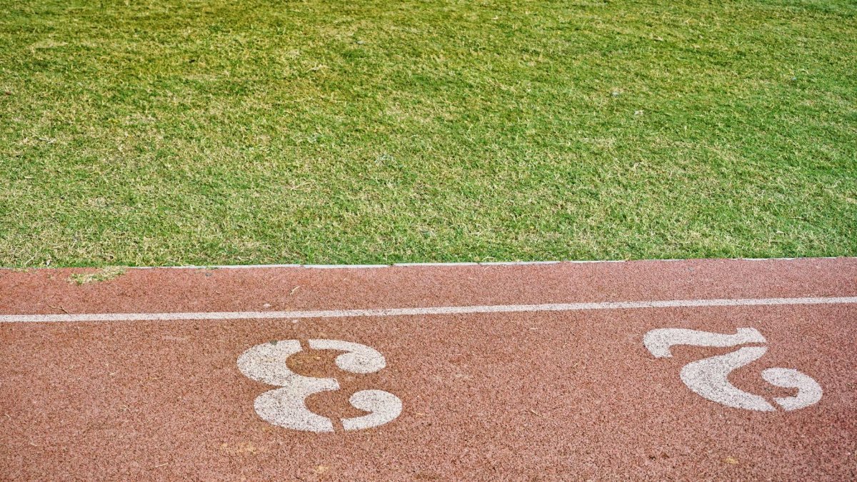 Image of a running track with lanes 2 and 3 clearly marked, perfect for sports concepts.