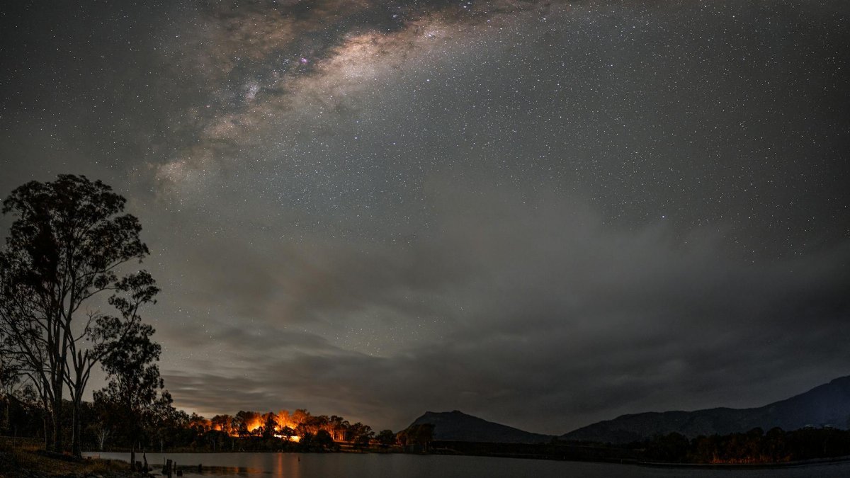 Beautiful night sky with Milky Way visible over Maroon Lake, Australia, featuring starry night and tranquil waters.