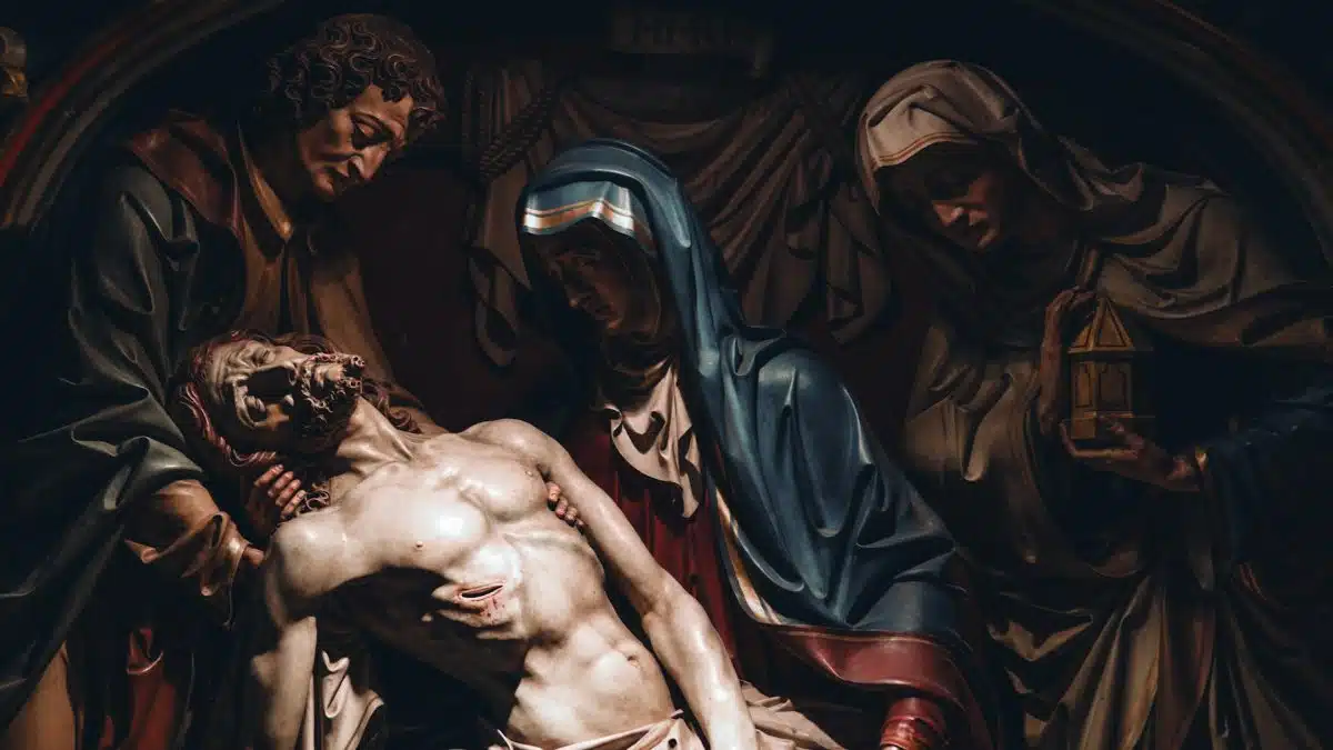Emotional depiction of Jesus Christ and Virgin Mary in a classical sculpture, rich in detail.