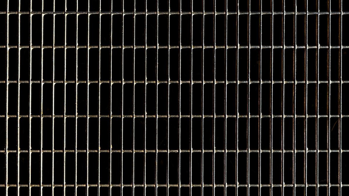 High-resolution photo of a grid-like steel texture with a geometric pattern.