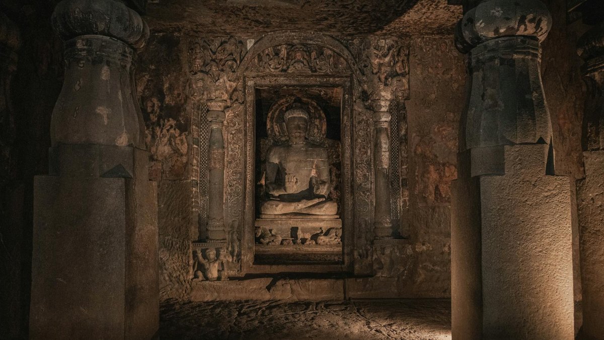 Intricate Buddha sculpture inside the historic Ajanta Caves in Maharashtra, India.