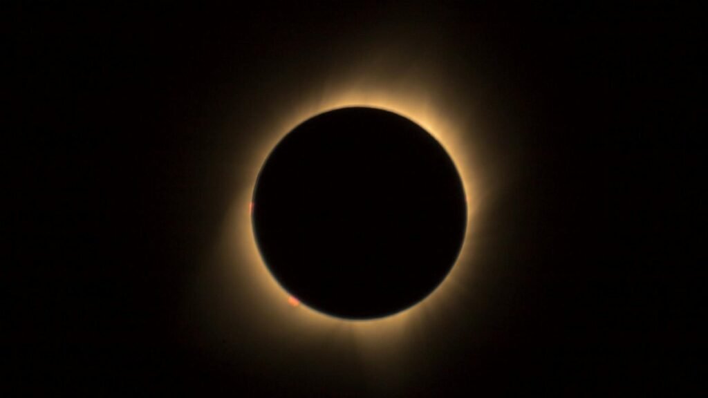 A captivating view of a solar eclipse highlighting the glowing corona in a dark sky.