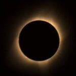A captivating view of a solar eclipse highlighting the glowing corona in a dark sky.