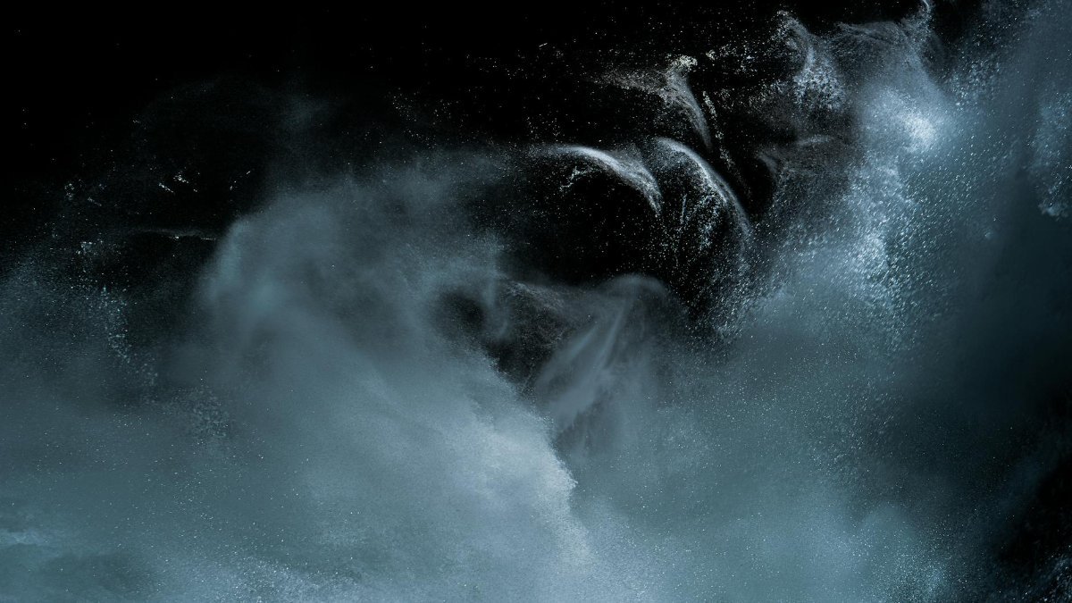 Captivating motion of water captured in dynamic splash against a black backdrop.