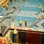 High-angle view of construction workers on a building site, engaging in construction work.
