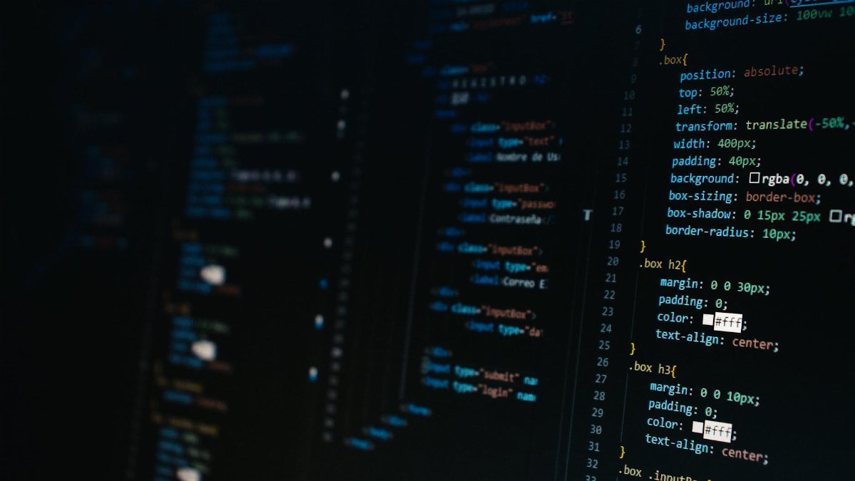 Detailed view of HTML and CSS code on a dark screen, representing modern web development.