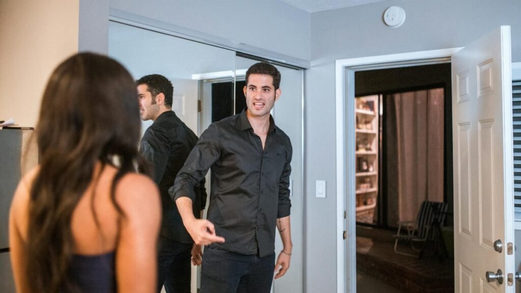 A couple having an intense discussion in a contemporary living room setting with reflections.