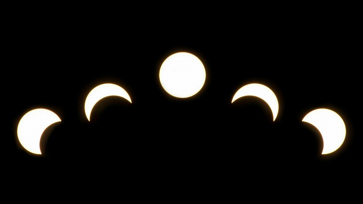 A minimalist depiction of solar eclipse phases captured in a crescent pattern on a dark background.