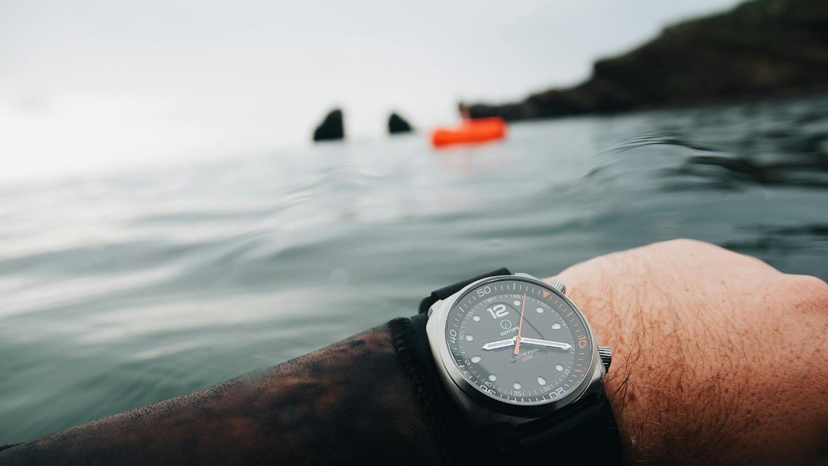 A close-up of a diver's watch in the ocean at Agde, France, symbolizing adventure and time.