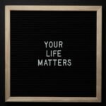 A chalkboard with the motivational message 'Your Life Matters' in white letters.