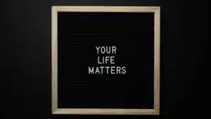 A chalkboard with the motivational message 'Your Life Matters' in white letters.
