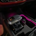 Close-up of a luxury car's gear shift with ambient lighting in Dubai.