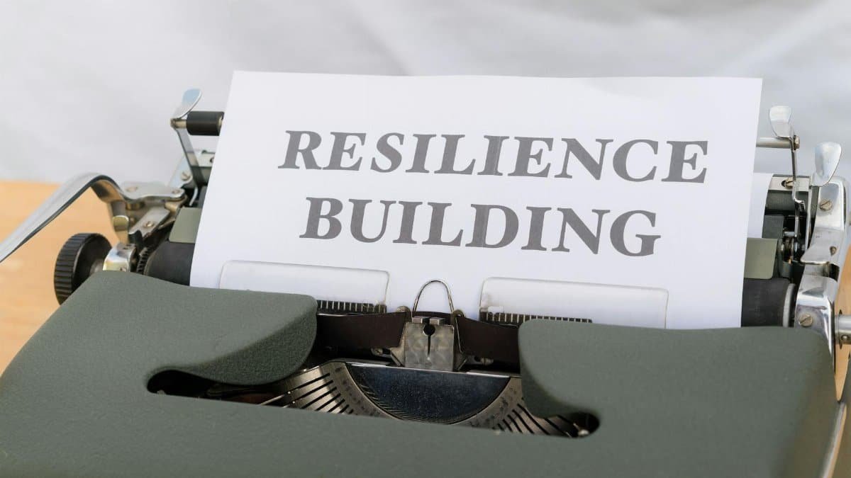 A vintage typewriter with a paper showing "Resilience Building," symbolizing personal growth and resilience.