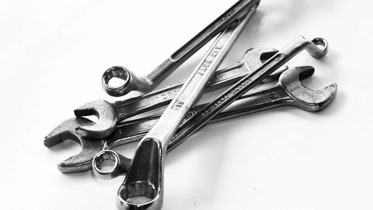 A collection of steel wrenches displayed against a white backdrop, perfect for toolkits.
