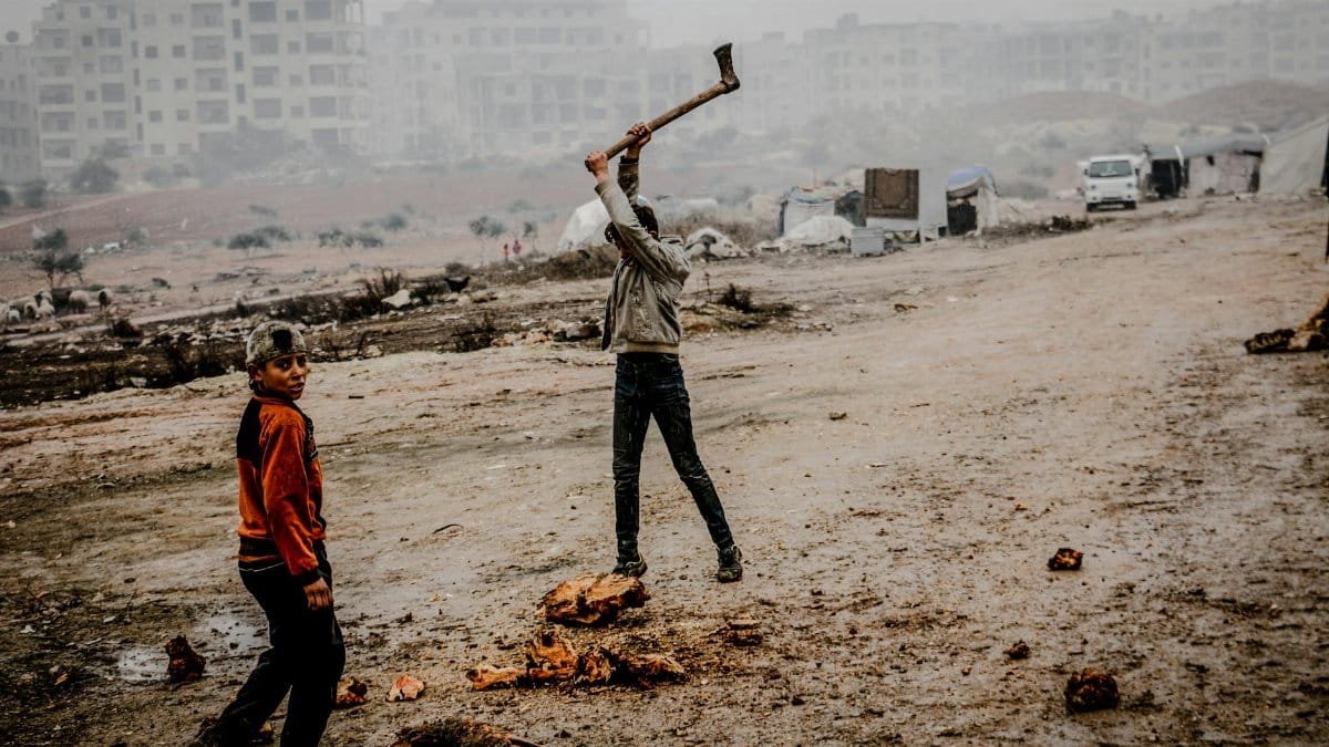 Scene of daily life in fog-covered Idlib, Syria, capturing urban struggle and resilience.