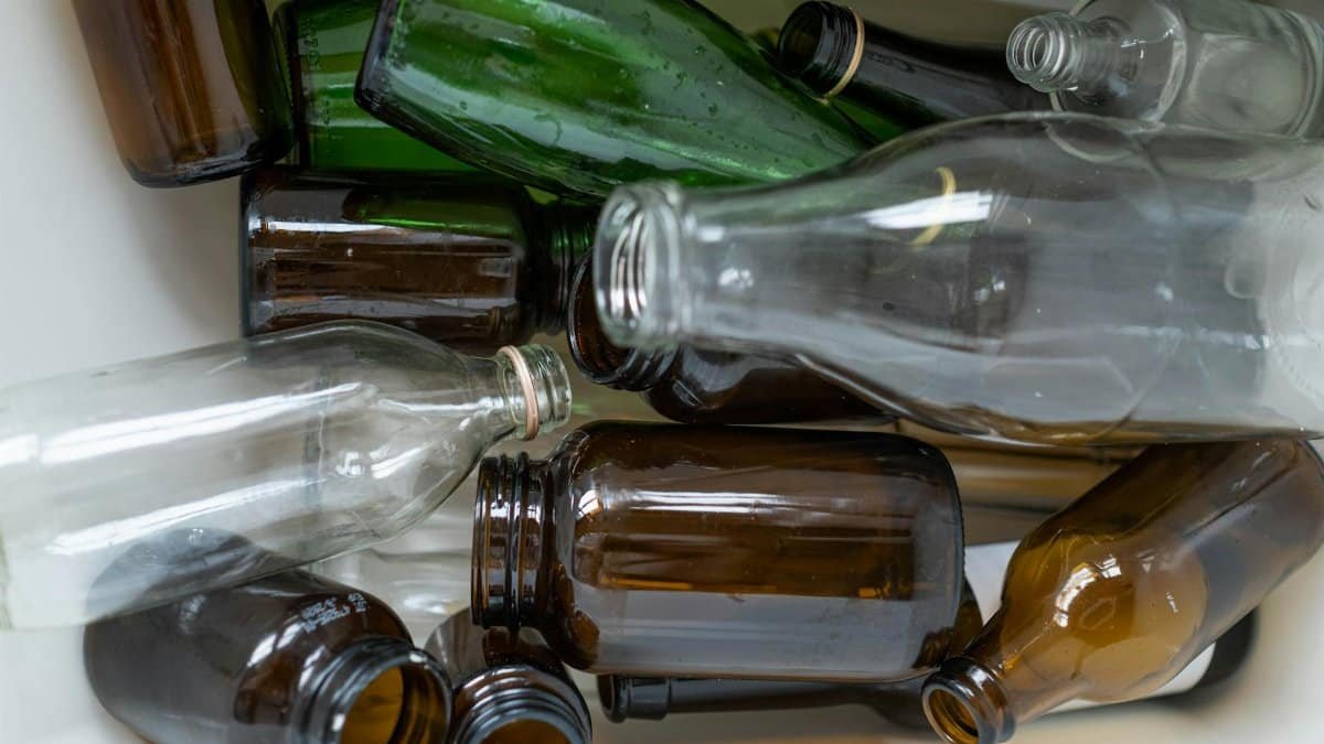 A detailed view of assorted recyclable glass bottles, showcasing their potential for reuse and environmental sustainability.