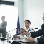 Panelists at an EU conference discussing law and diplomacy.