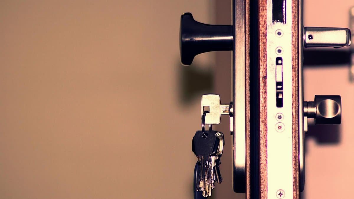 Detailed view of a door lock and keys emphasizing security and access.
