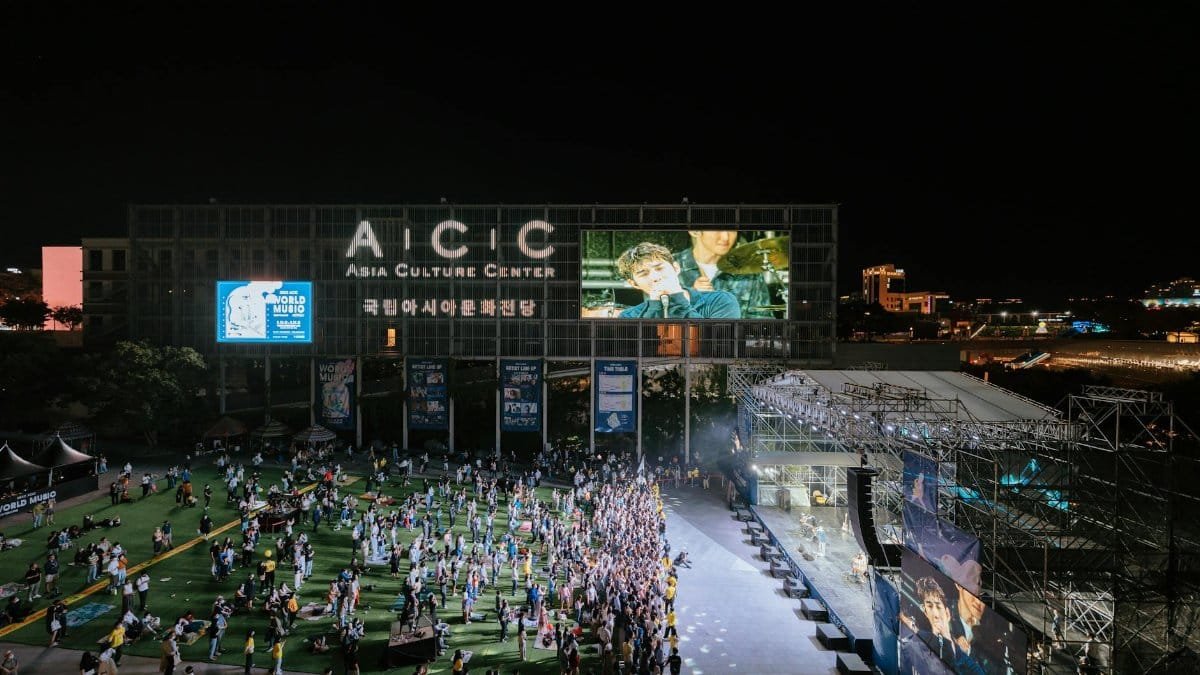 A lively night concert at the Asia Culture Center with an energetic crowd.