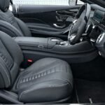 Explore the sleek and modern interior of a luxurious Mercedes-Benz, featuring premium black leather seats and a stylish dashboard.