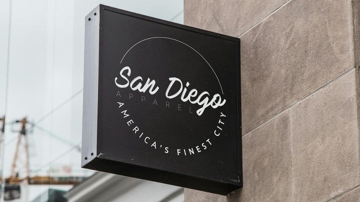 Storefront signage for a San Diego apparel shop displaying city pride.
