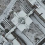 Drone shot of snow-covered buildings and streets in urban Xi Qing Qu, Tian Jin Shi, China.