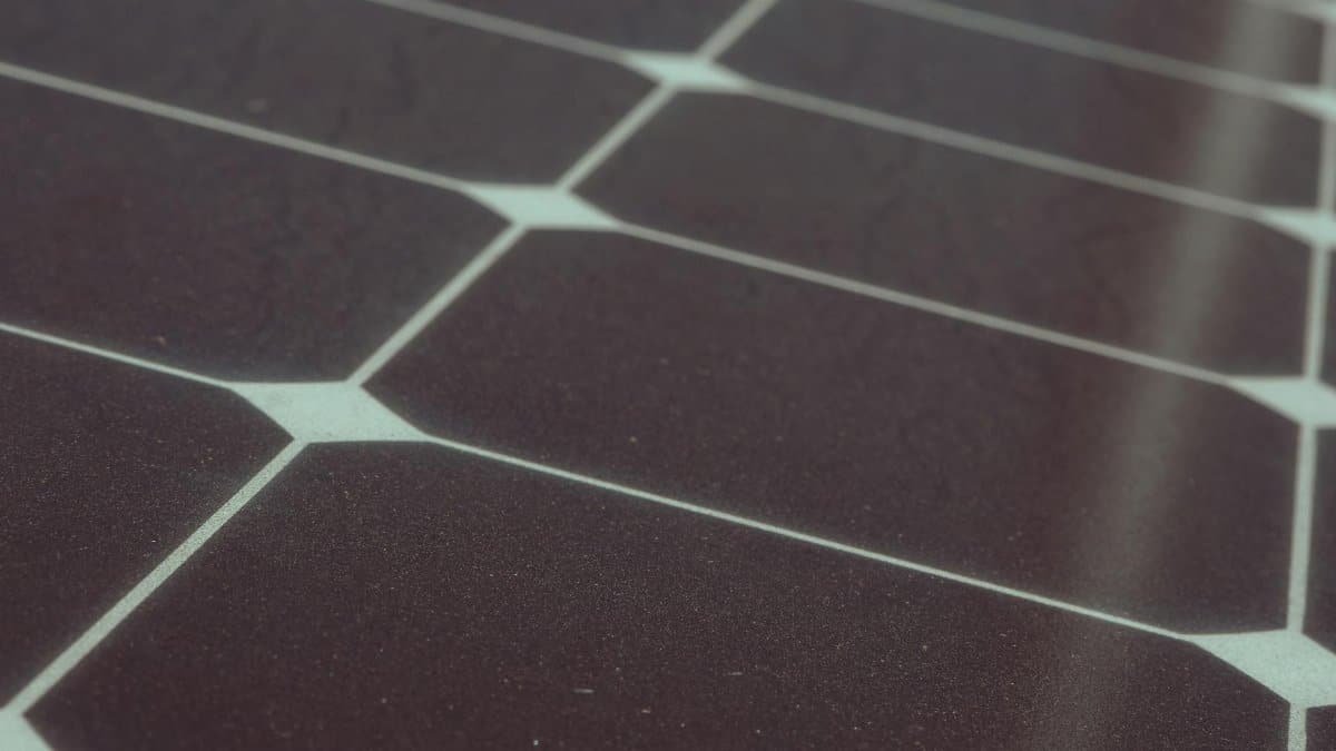 Detailed view of solar panel cells for alternative energy generation and innovation in technology.