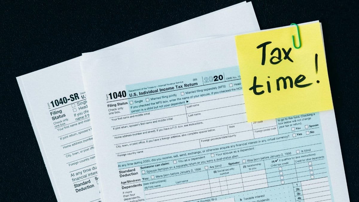 U.S. tax documents with a 'Tax time!' reminder, highlighting the importance of filing deadlines.