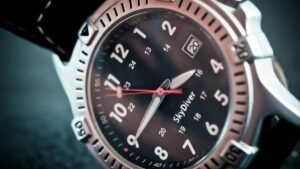 Close-up shot of a sleek diver's wristwatch with labeled time and date display, ideal for adventure seekers.