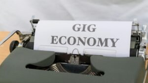 Close-up of a typewriter typing 'Gig Economy', symbolizing modern freelance work.
