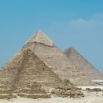 A stunning view of the Great Pyramids of Giza against a clear blue sky in Egypt.