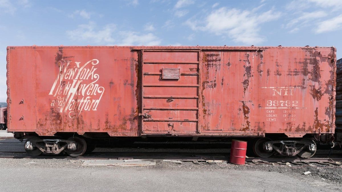 Rustic vintage boxcar at Danbury Railway Museum, showcasing historical railway design.