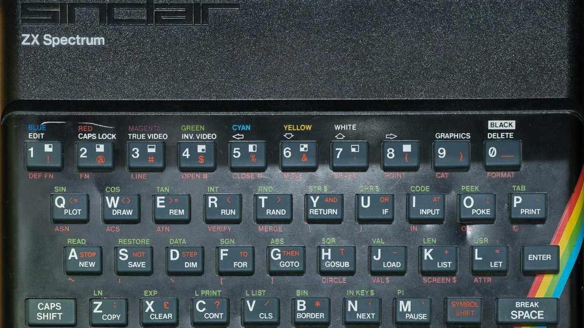 Close-up of a vintage Sinclair ZX Spectrum keyboard showcasing its colorful keys and retro design.