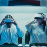 Two adults engaged in a virtual reality experience using VR headsets in a futuristic setting.