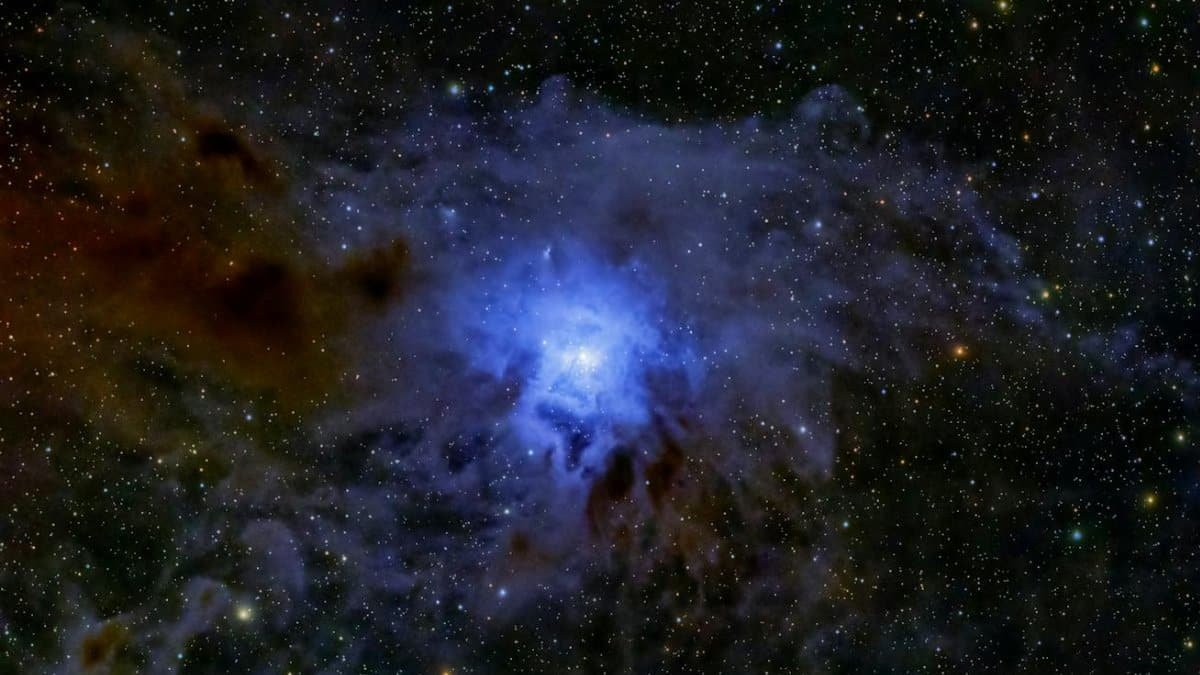 Captivating image of a glowing nebula amidst a canvas of stars, showcasing cosmic beauty.