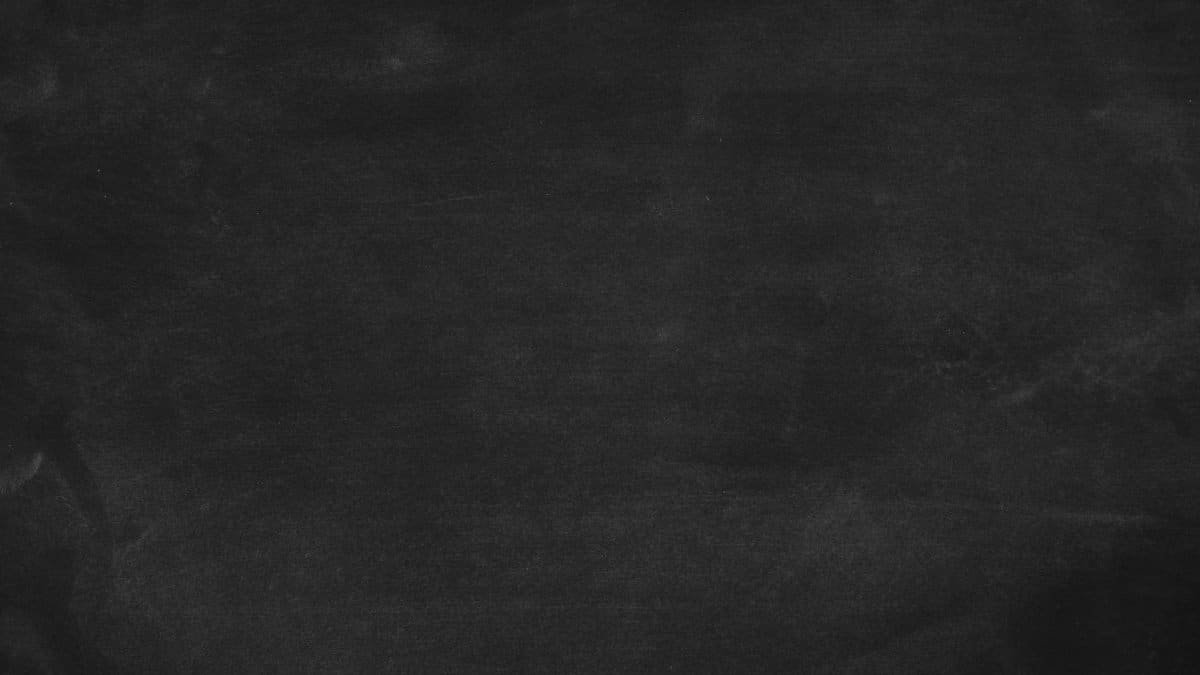Blank black chalkboard texture perfect for educational design and copy space.