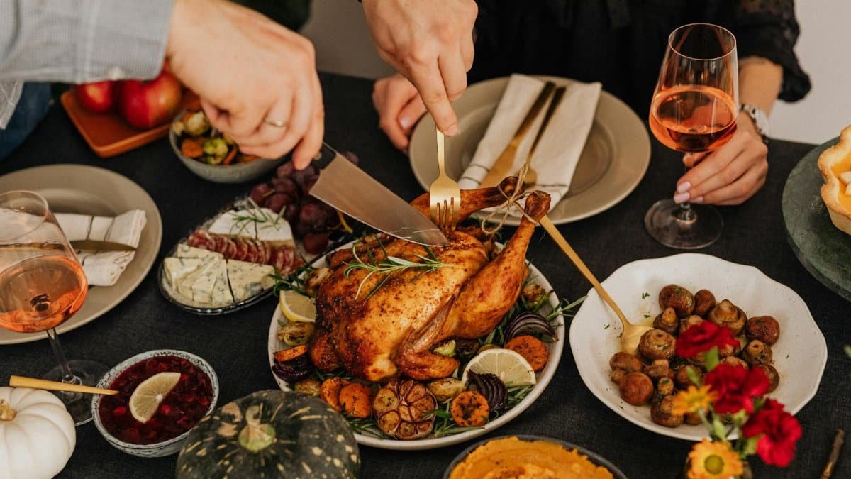 A delicious Thanksgiving dinner featuring roasted chicken and various side dishes.