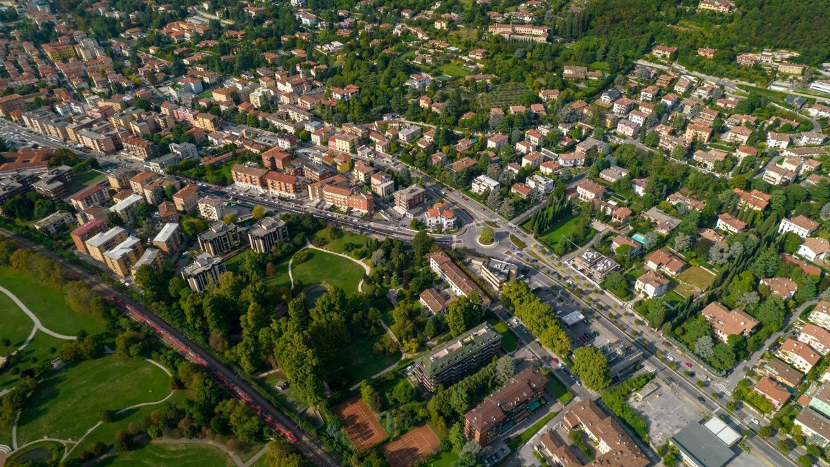 A stunning aerial view of an Italian town showcasing architecture and greenery.