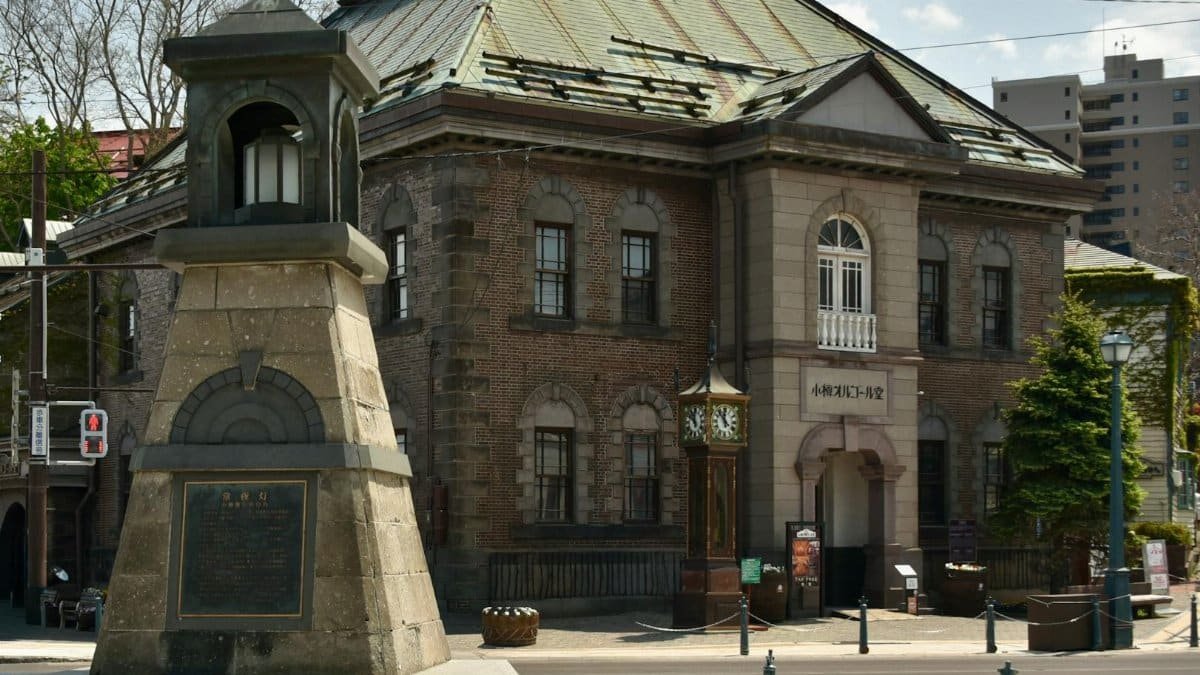 A classic stone building and clock tower in Otaru, Japan's charming historic district.