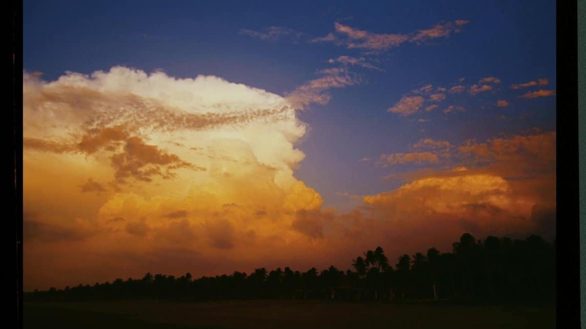 Capture of a vibrant sunset with dramatic clouds on Kodak Portra 400 film.
