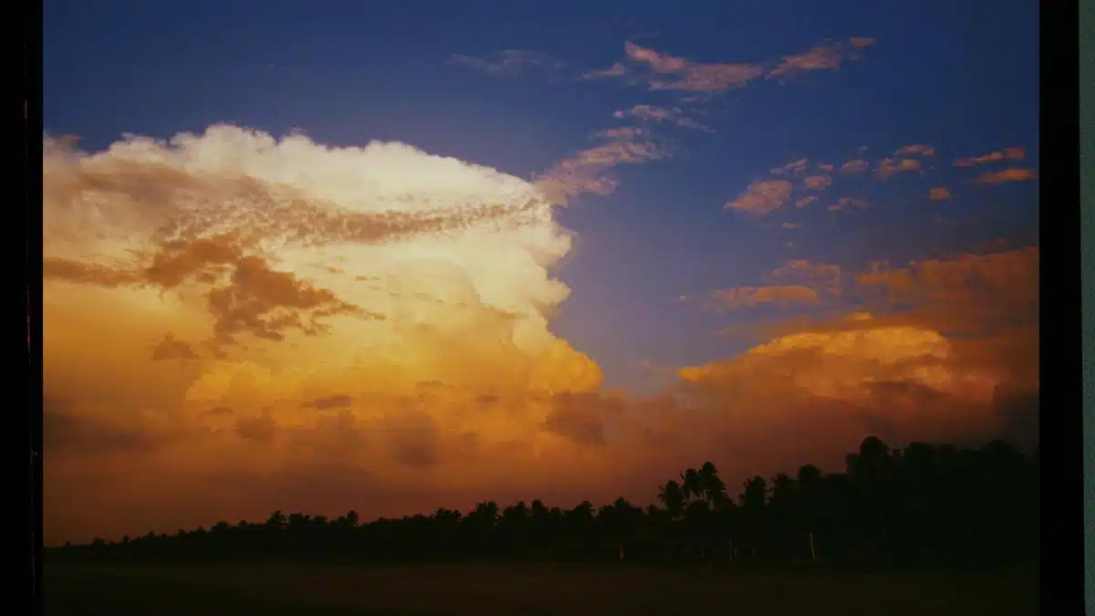 Capture of a vibrant sunset with dramatic clouds on Kodak Portra 400 film.