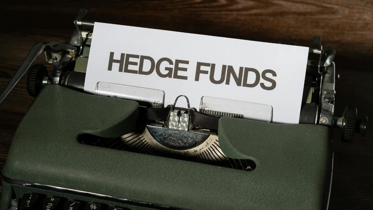 Close-up of a vintage typewriter with a paper labeled 'Hedge Funds'.