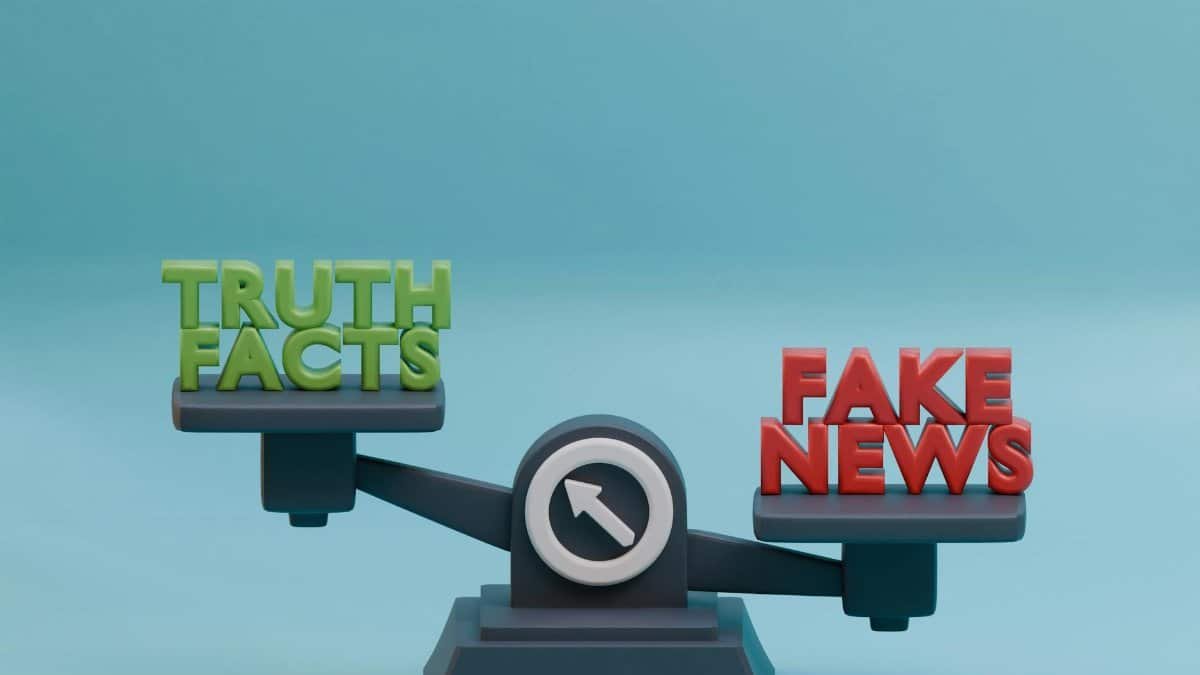 3D illustration of a scale balancing truth and fake news concept against a blue background.