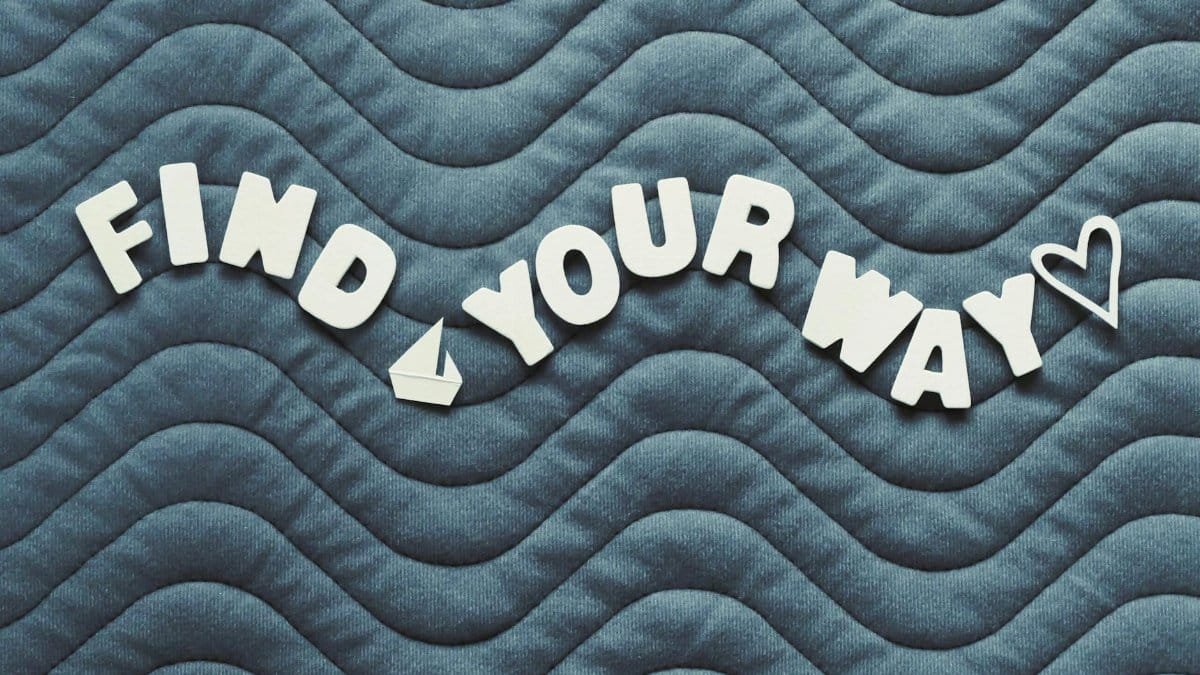 Motivational quote 'Find Your Way' on wave pattern background with heart icon.