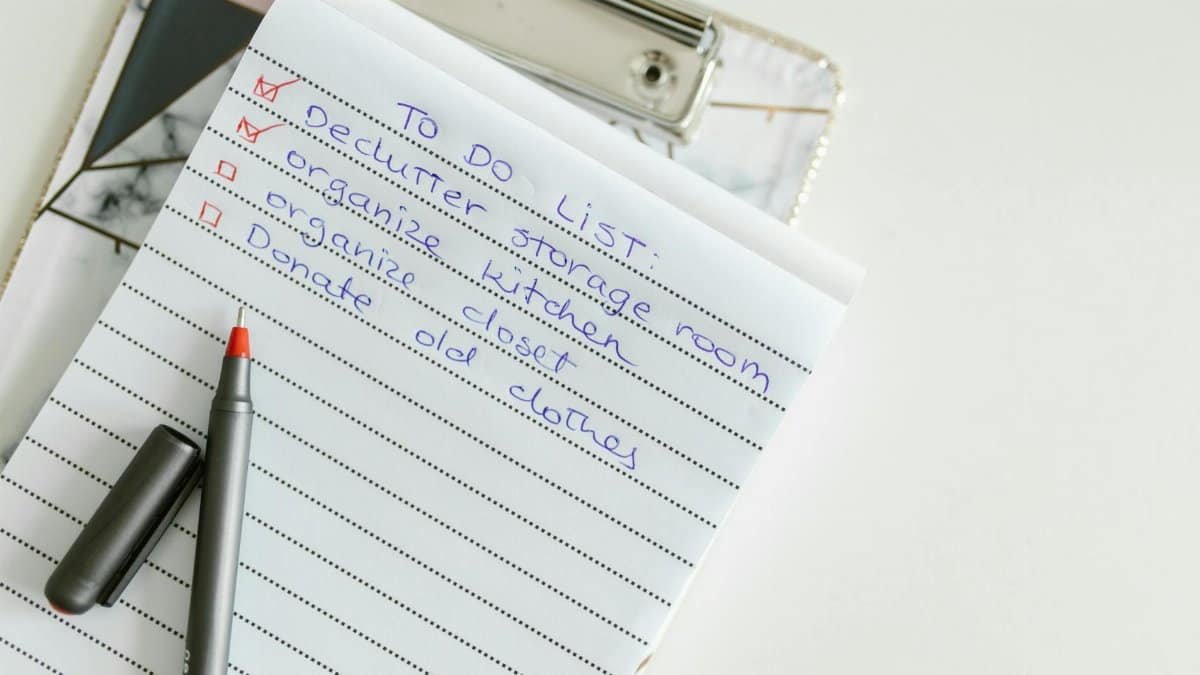 A neatly written to-do list on lined paper with a pen, perfect for organizing tasks.