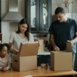 Family unpacking boxes in their new kitchen, enjoying a fresh start in a cozy home.