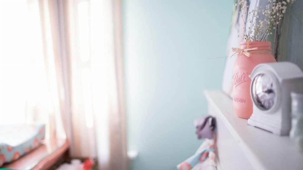 Calm interior scene featuring soft light, mason jar decor, and a gentle pastel color palette.