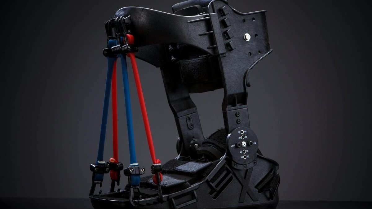 High-quality orthopedic ankle brace with adjustable straps set against a sleek black background.